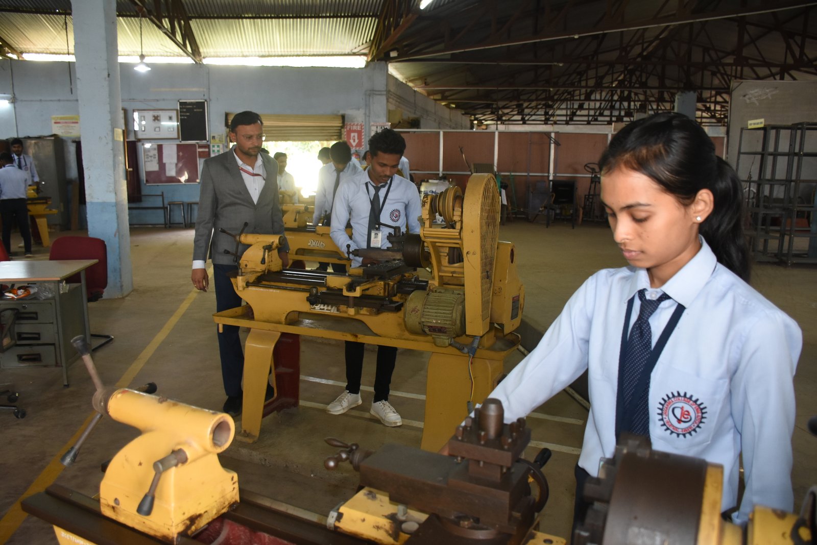 University students studying with teacher